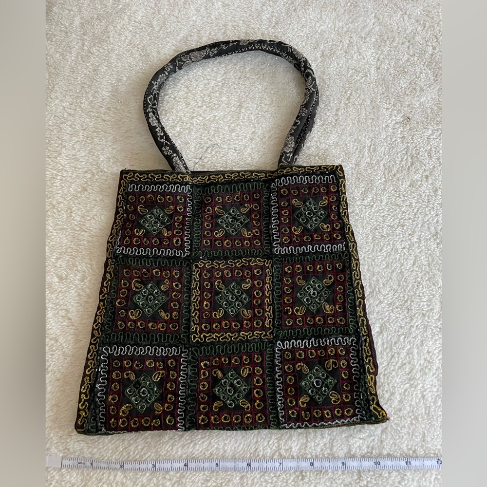 Embroidered, beaded on black ornate handbag